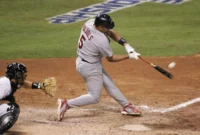 baseball player hitting home run